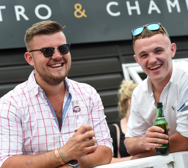 Two guys enjoying a drink at Uttoxeter Races