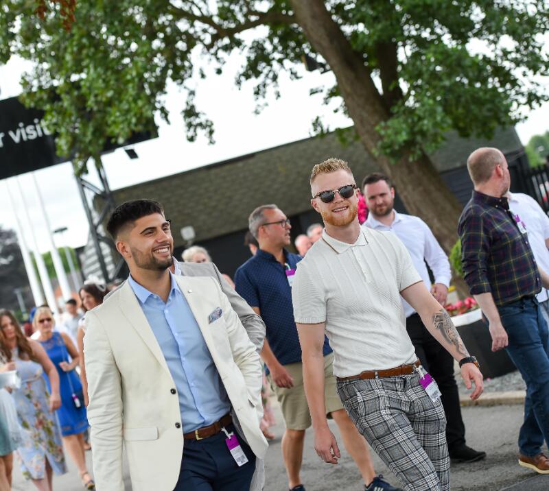 Two smartly dressed gentlemen heading into Uttoxeter Racecourse