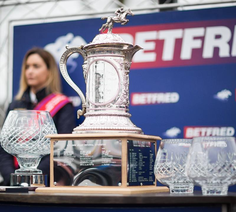 Trophy standing on a table next to a podium.